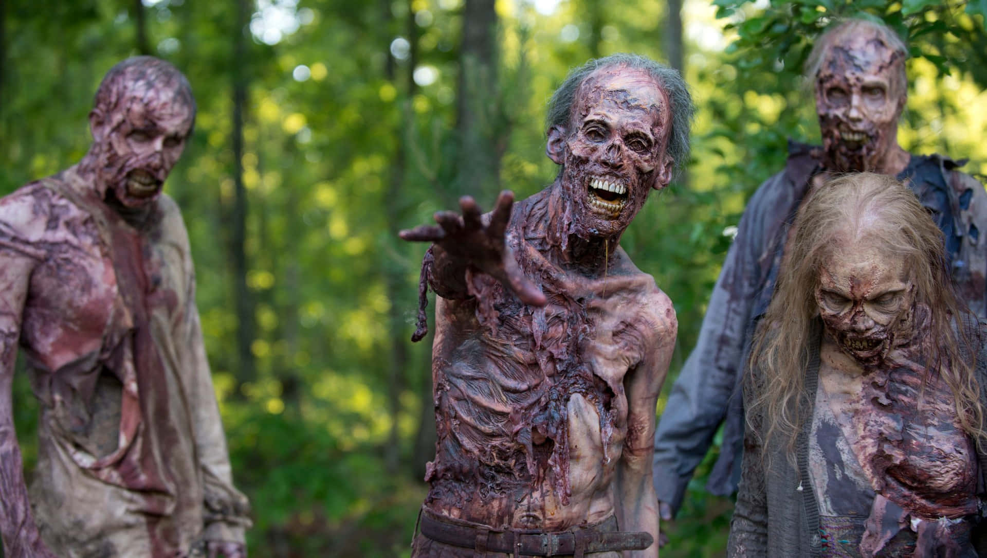 the walking dead season 3 - a group of zombies in the woods