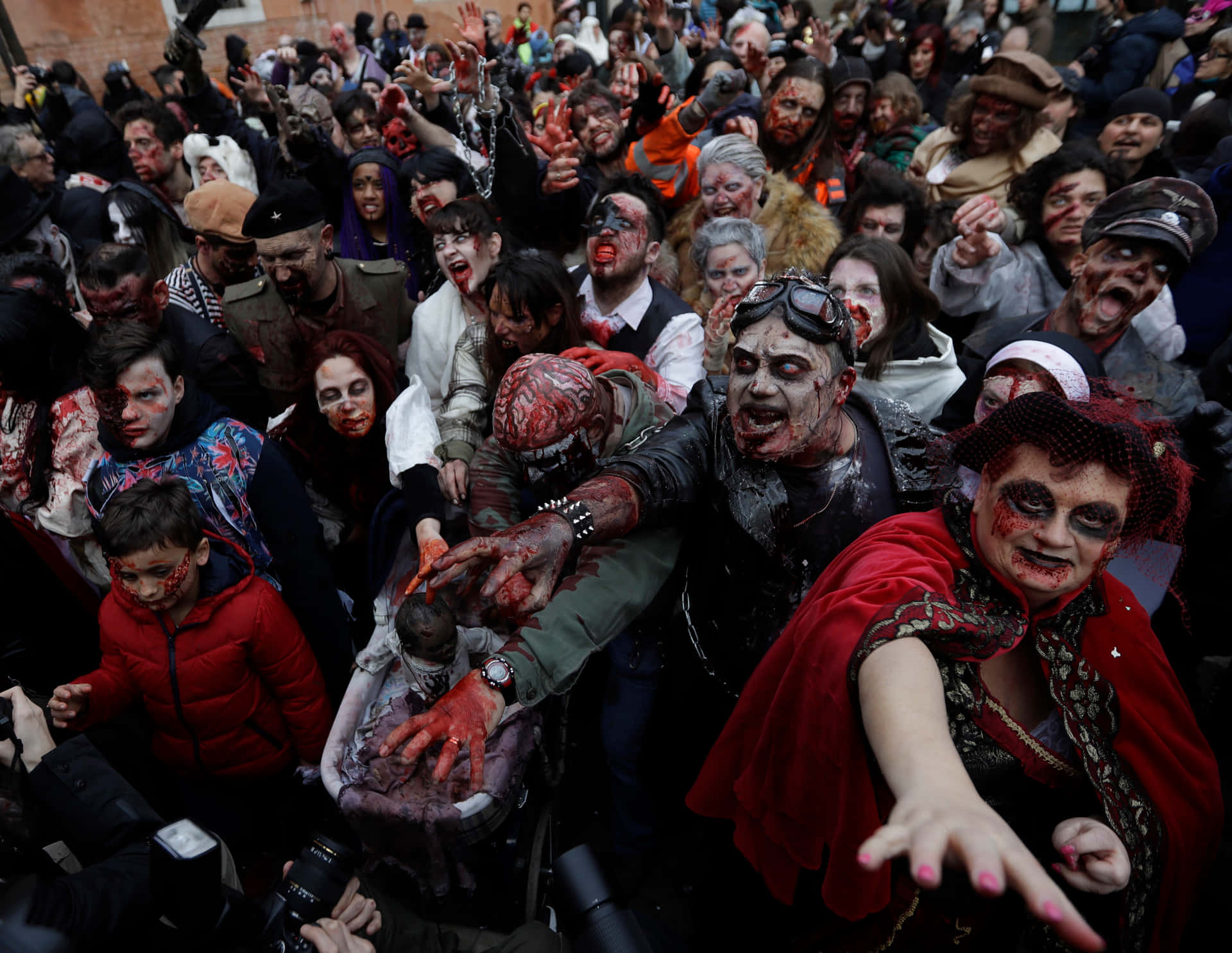 a crowd of people dressed in zombie costumes