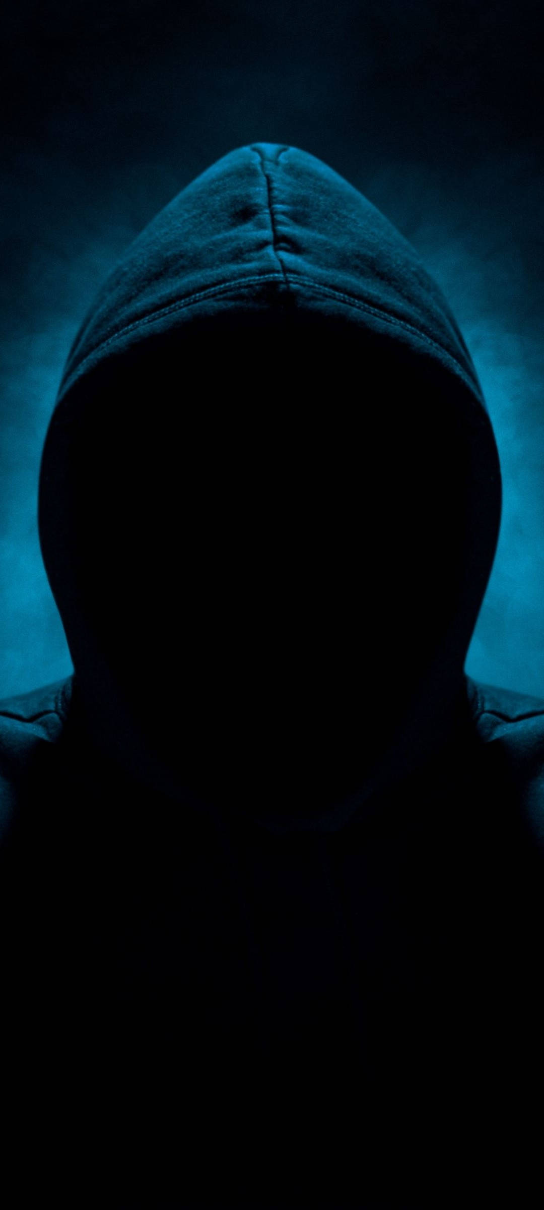 A mysterious hooded figure showcasing the cutting-edge Realme 7 smartphone. Wallpaper