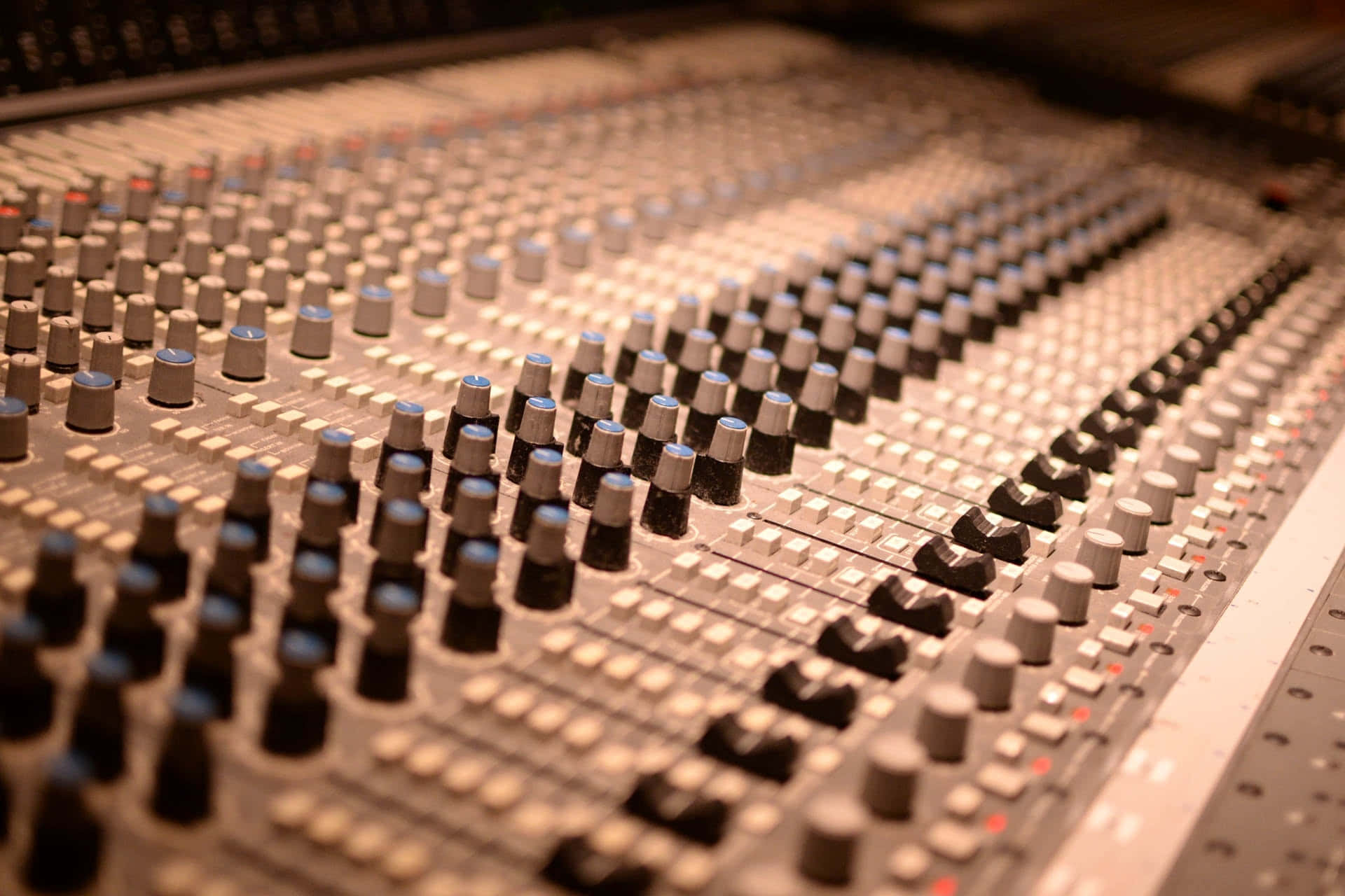 A Close Up Of A Mixing Board