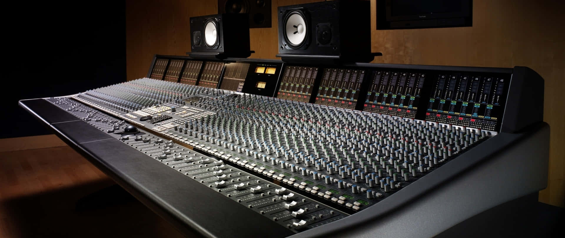 A Large Mixing Desk With Two Speakers