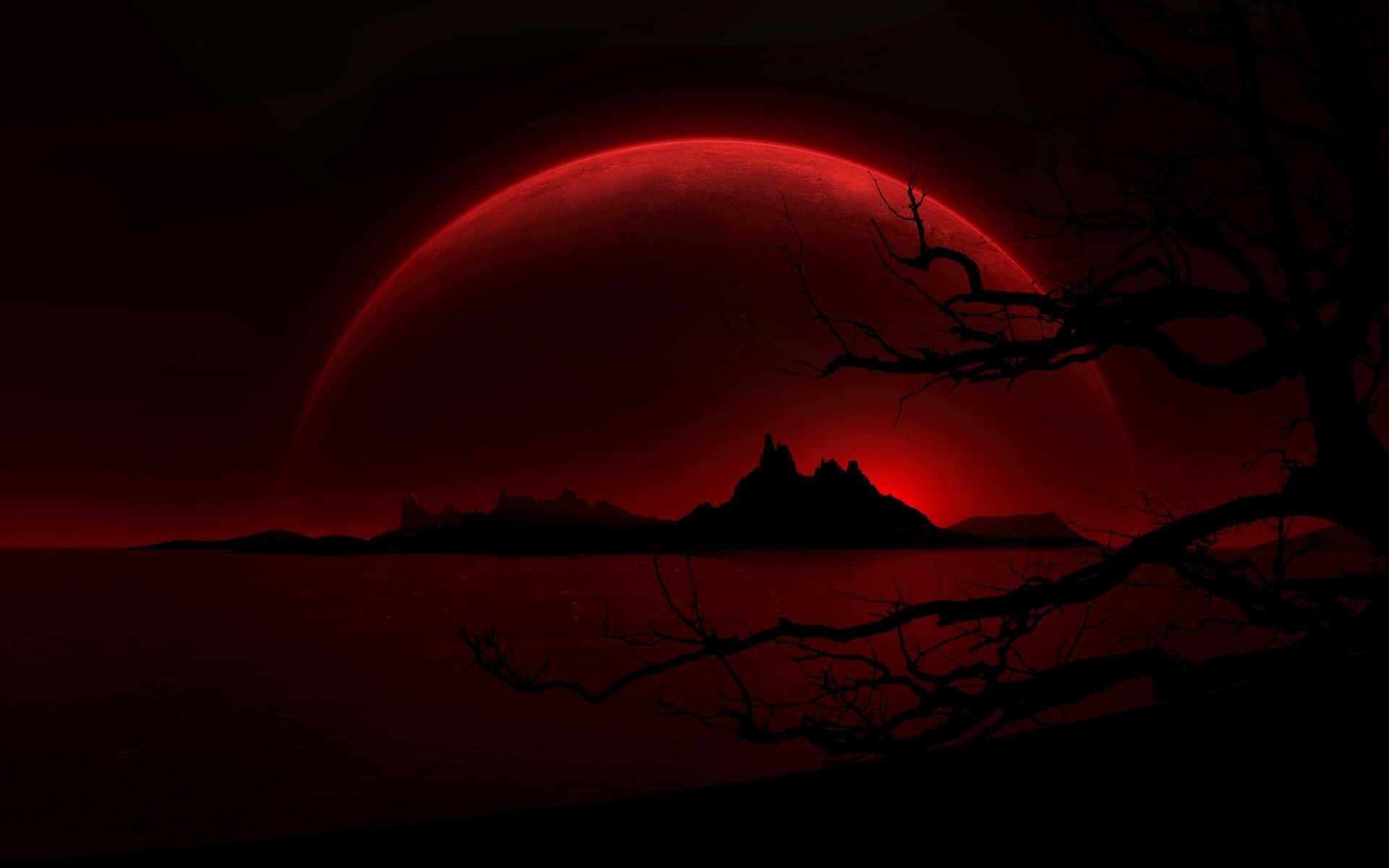 A Red Moon With A Tree In The Background