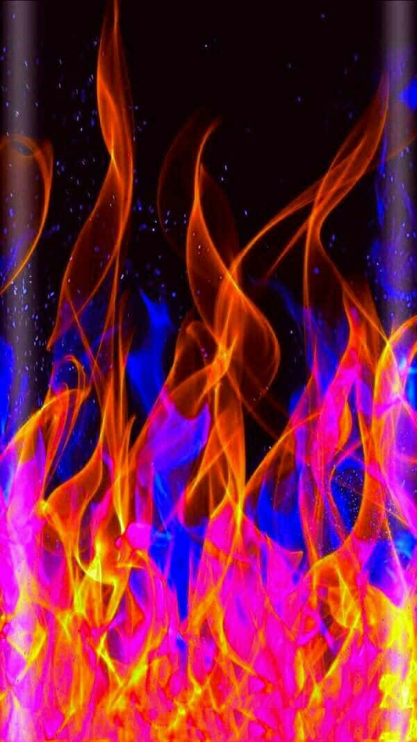 En brølende eksplosion af rød og blå ild. Wallpaper