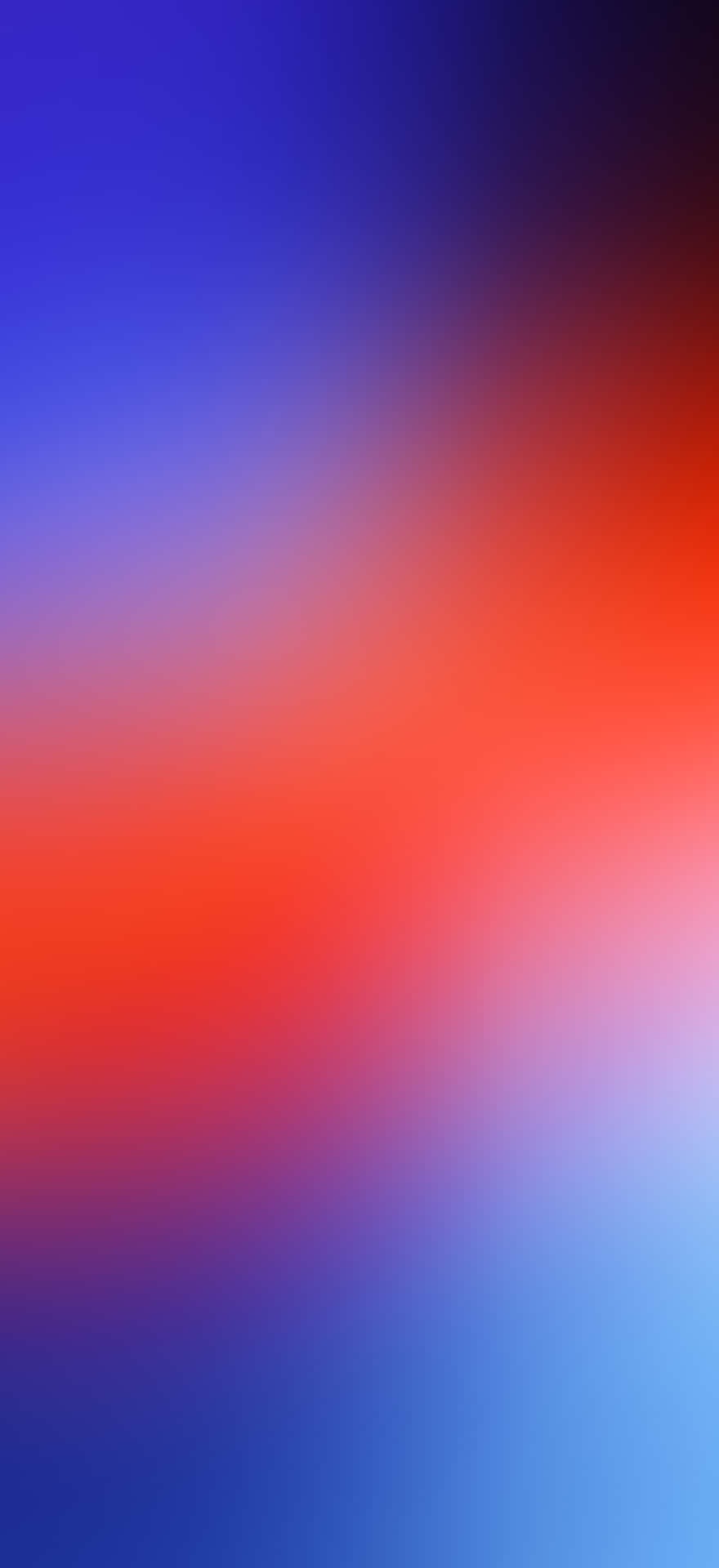 En sløret baggrund med blå, rød og orange farver. Wallpaper