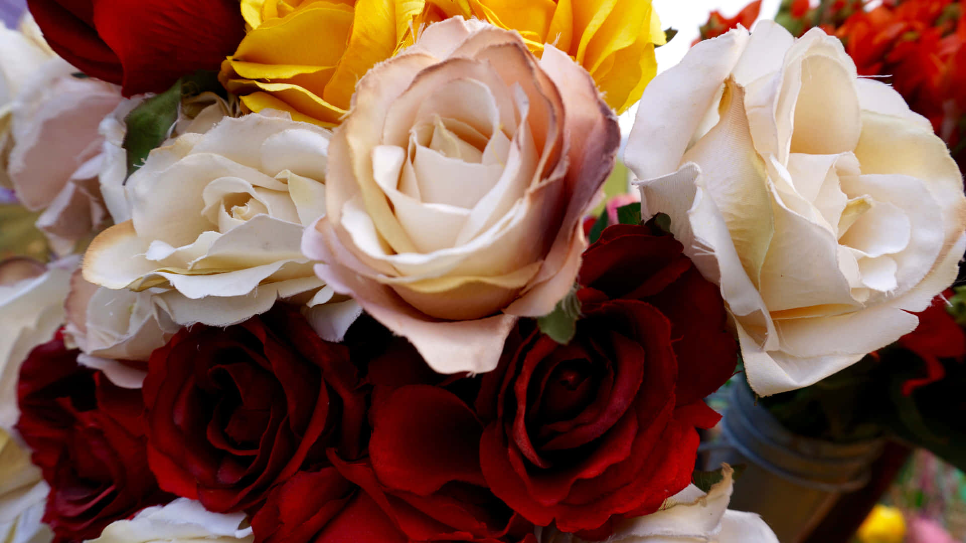 Red And White Roses In A Flower Arrangement Wallpaper