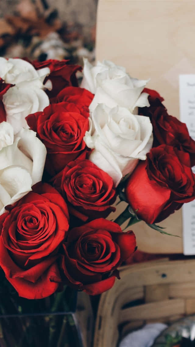 A Bundle Of Red And White Roses Wallpaper