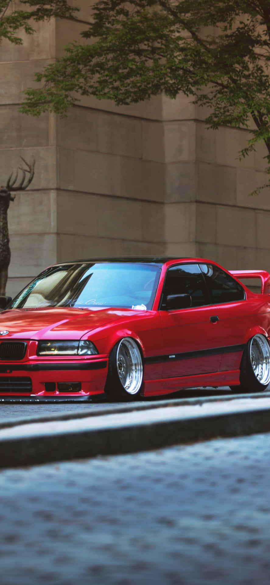 Red B M W E36 Coupe Urban Backdrop Wallpaper