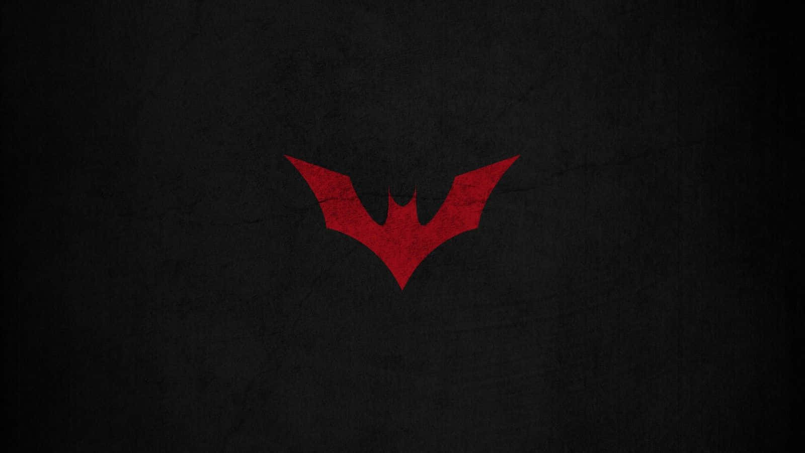 The Red Batman Logo Standing Tall Wallpaper