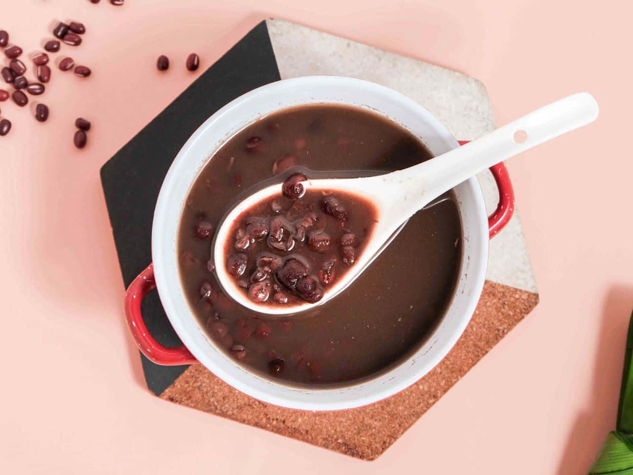 A close-up view of red beans on a spoon Wallpaper