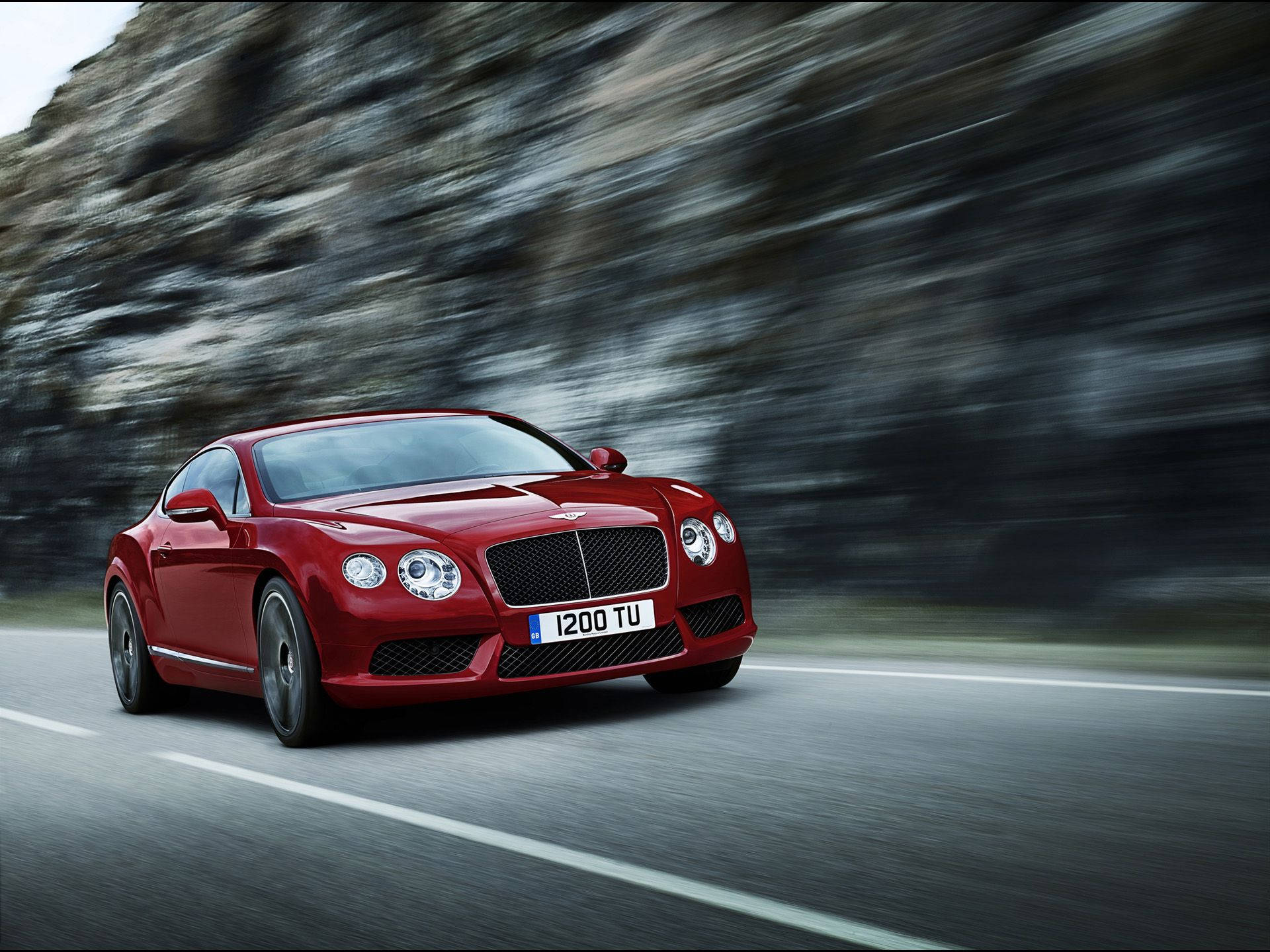 Red Bentley Speeding On The Road Wallpaper