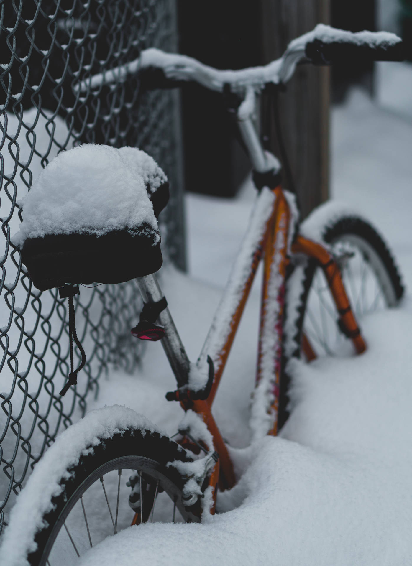 Red Bike Covered In Snow Background