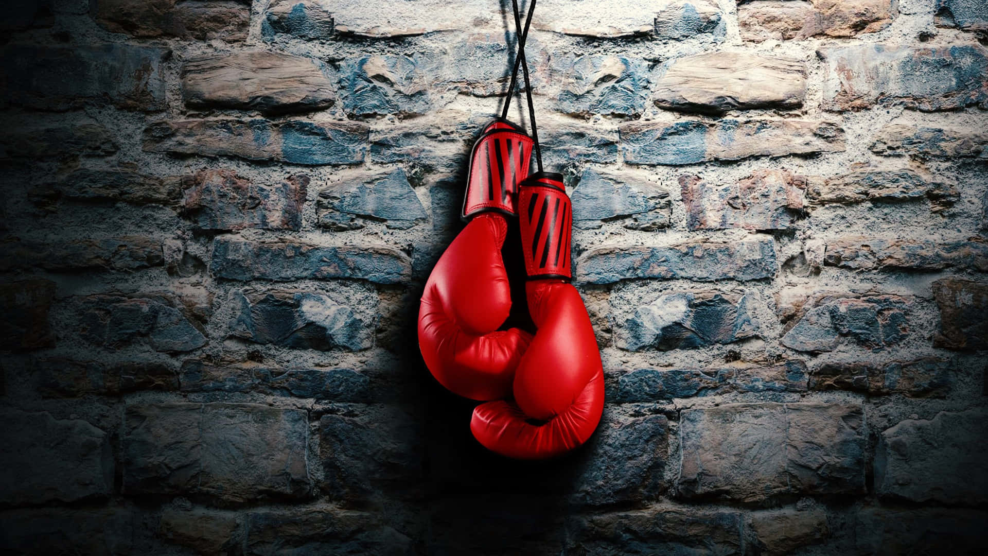 Red Boxing Gloves Hanging Stone Wall Wallpaper