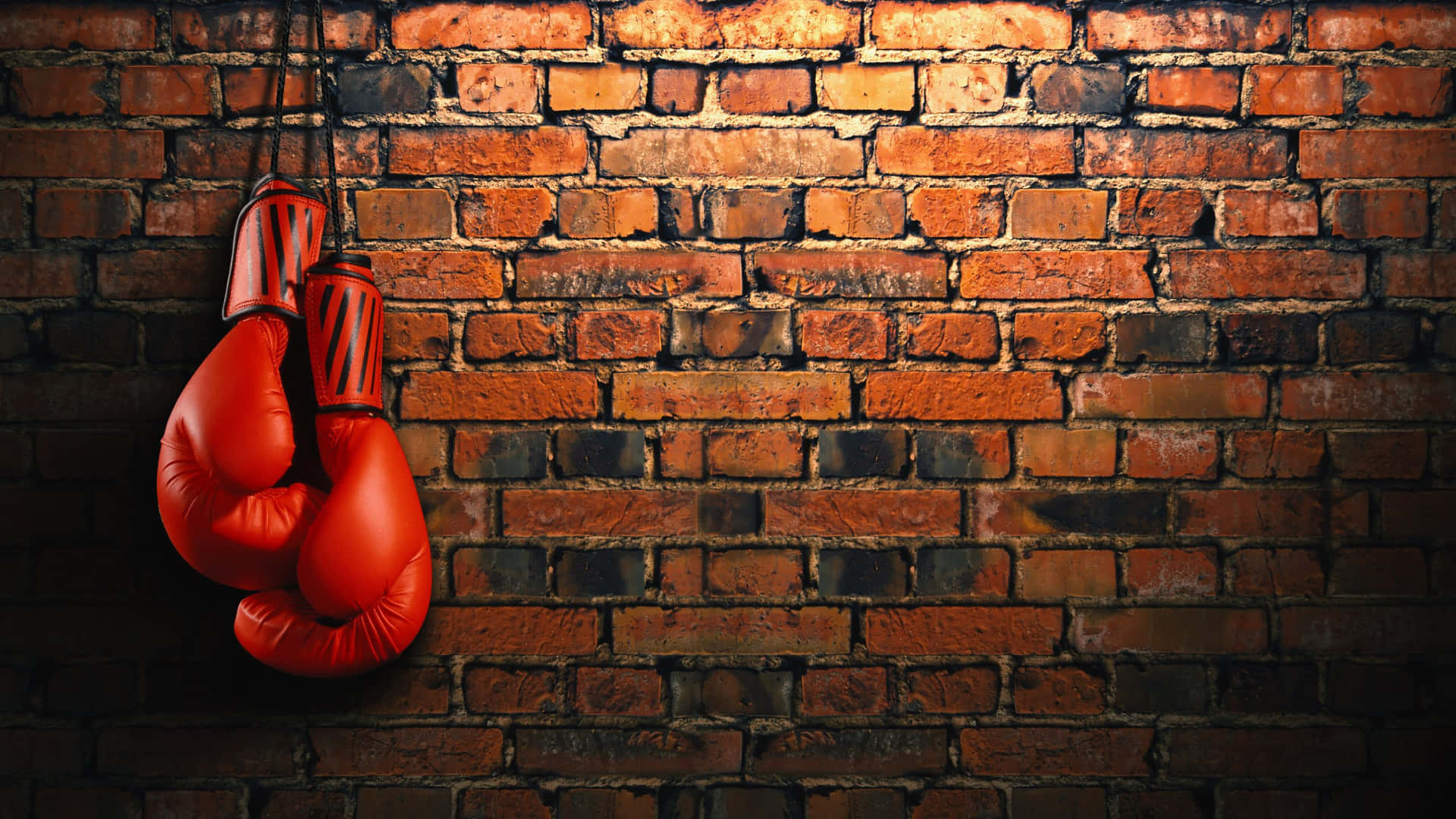 Red Boxing Gloves Hangingon Brick Wall Wallpaper