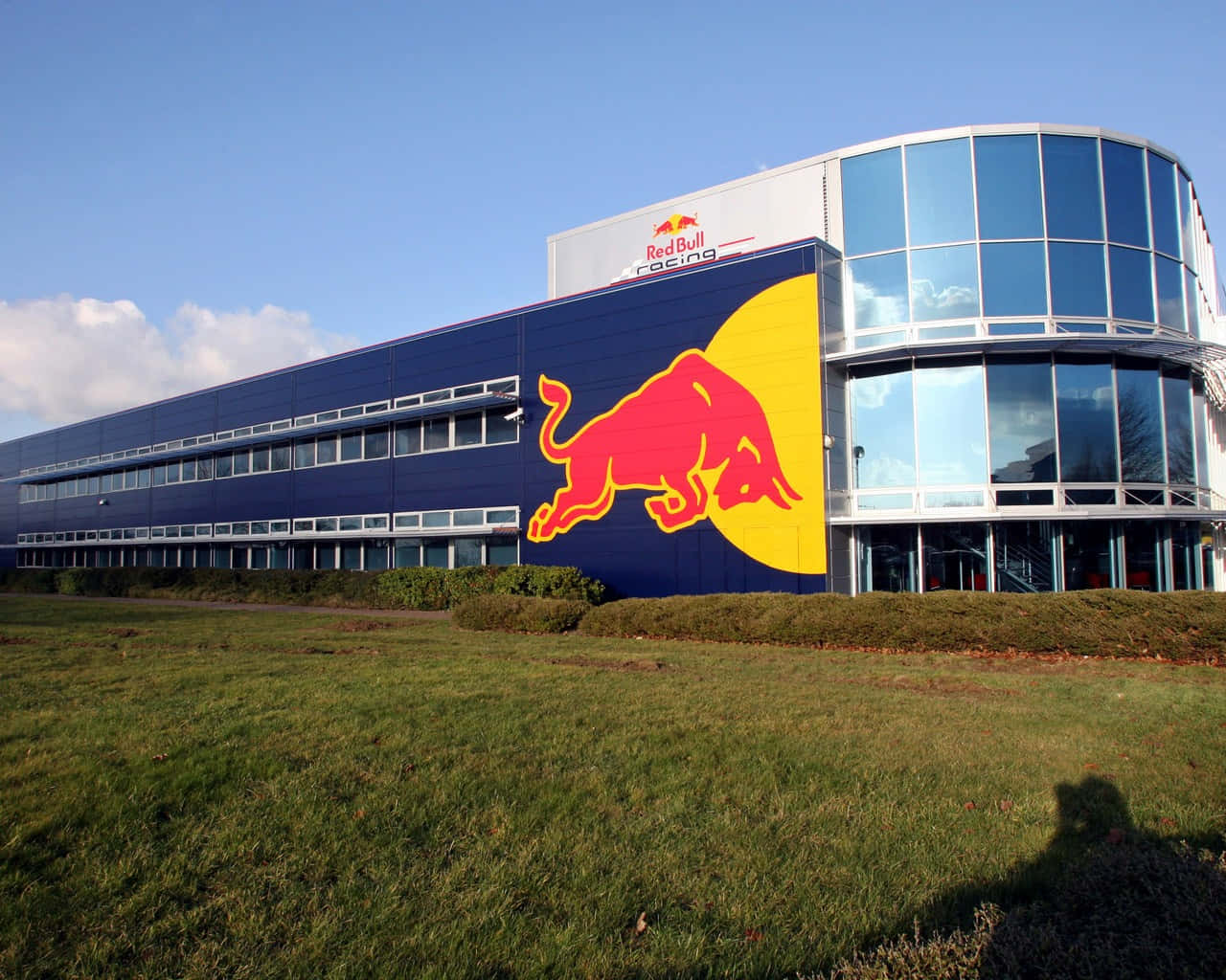 A Large Building With A Red Bull On It