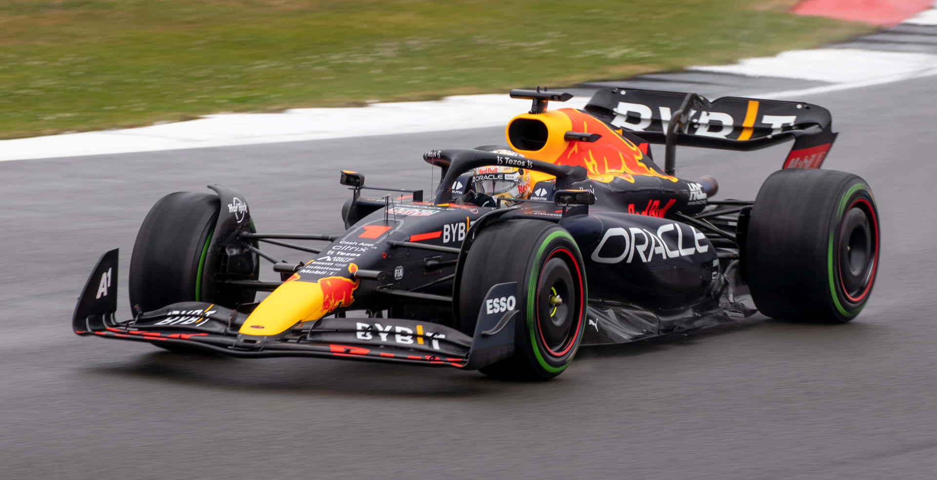 Red Bull Racing F1 Car Speedingon Track Wallpaper