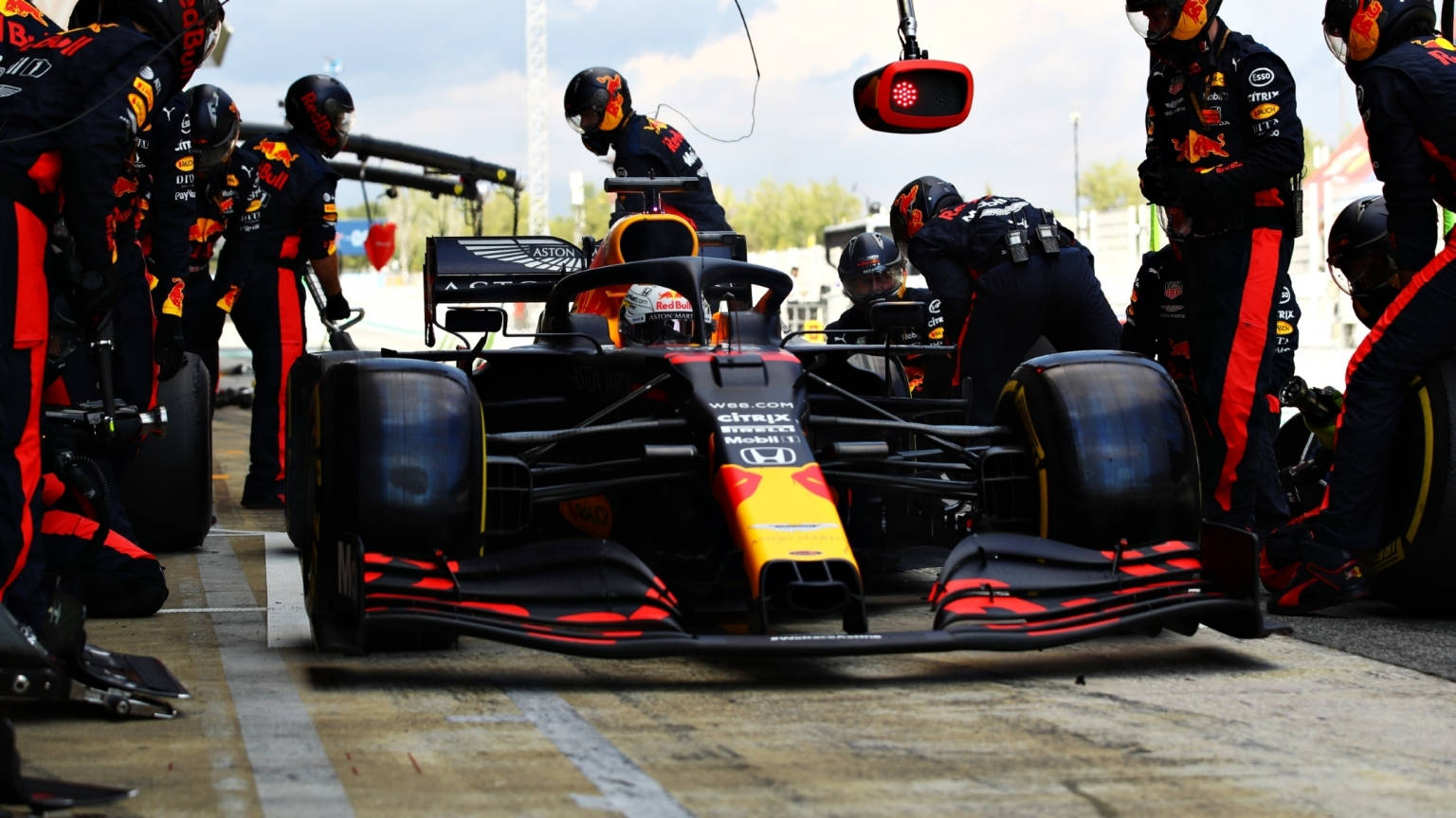 Thrilling Action at the Red Bull Racing Pit Stop Wallpaper