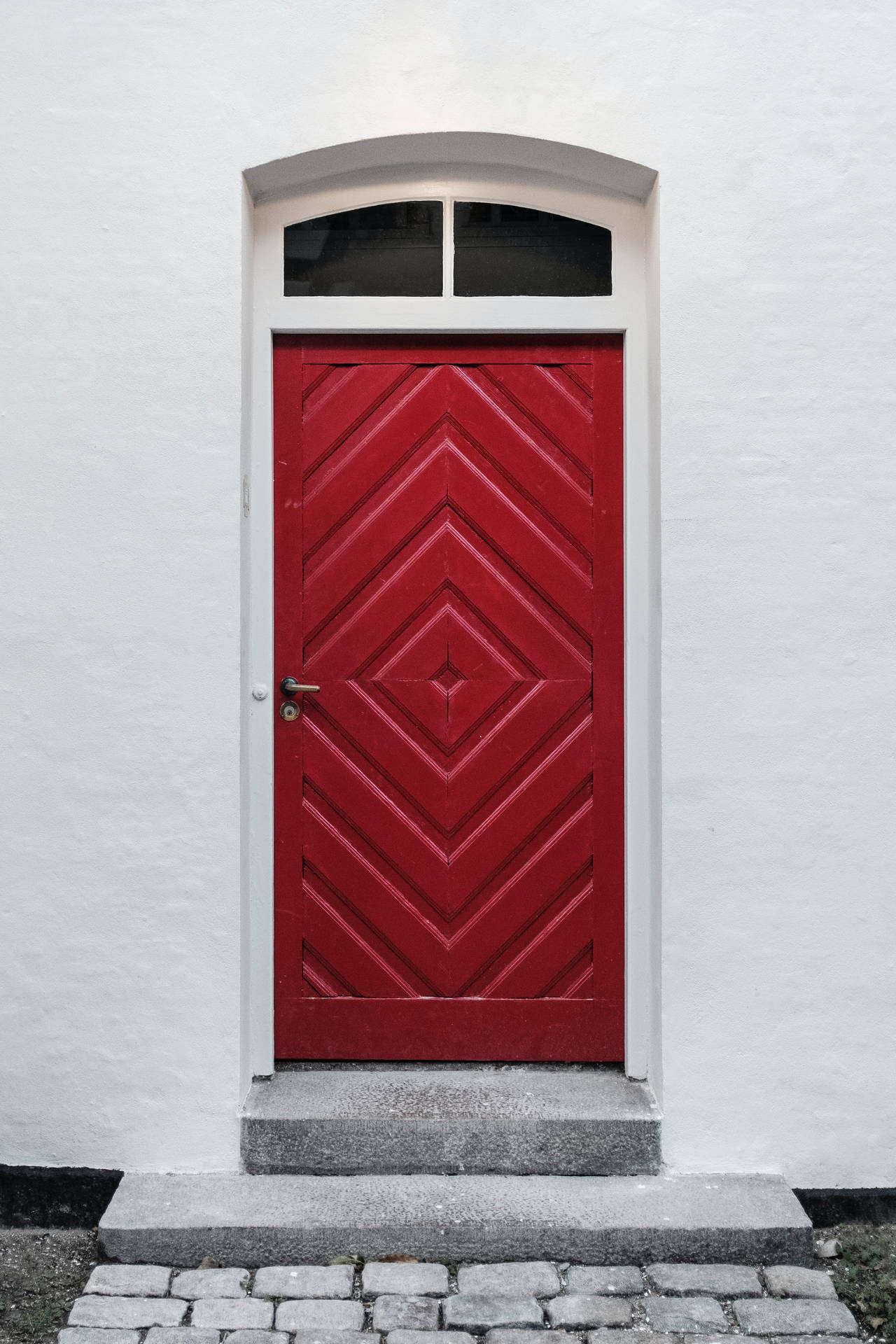 Red Carved Door With Geometrical Design Wallpaper