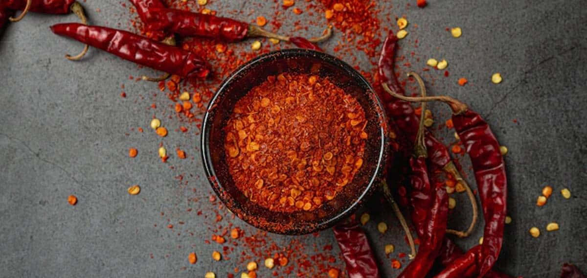 Vibrant Red Chili Powder Wallpaper