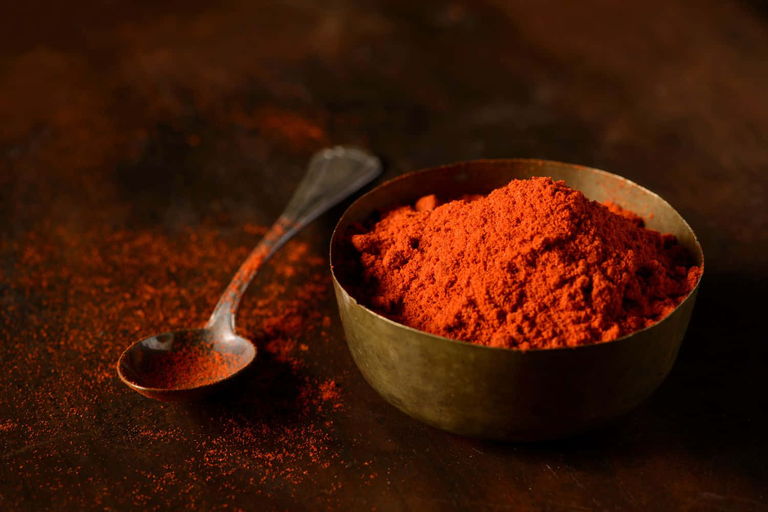 Red Chili Powder in a Bowl with Dried Red Chilies Around It Wallpaper