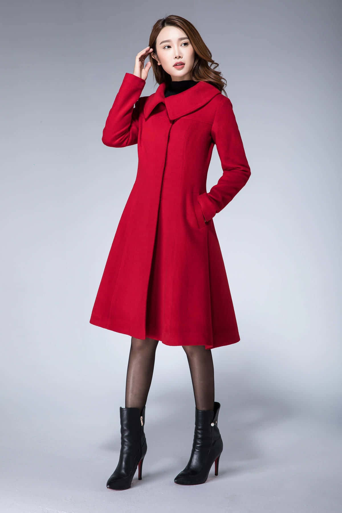 Elegant Woman in a Stylish Red Coat Wallpaper