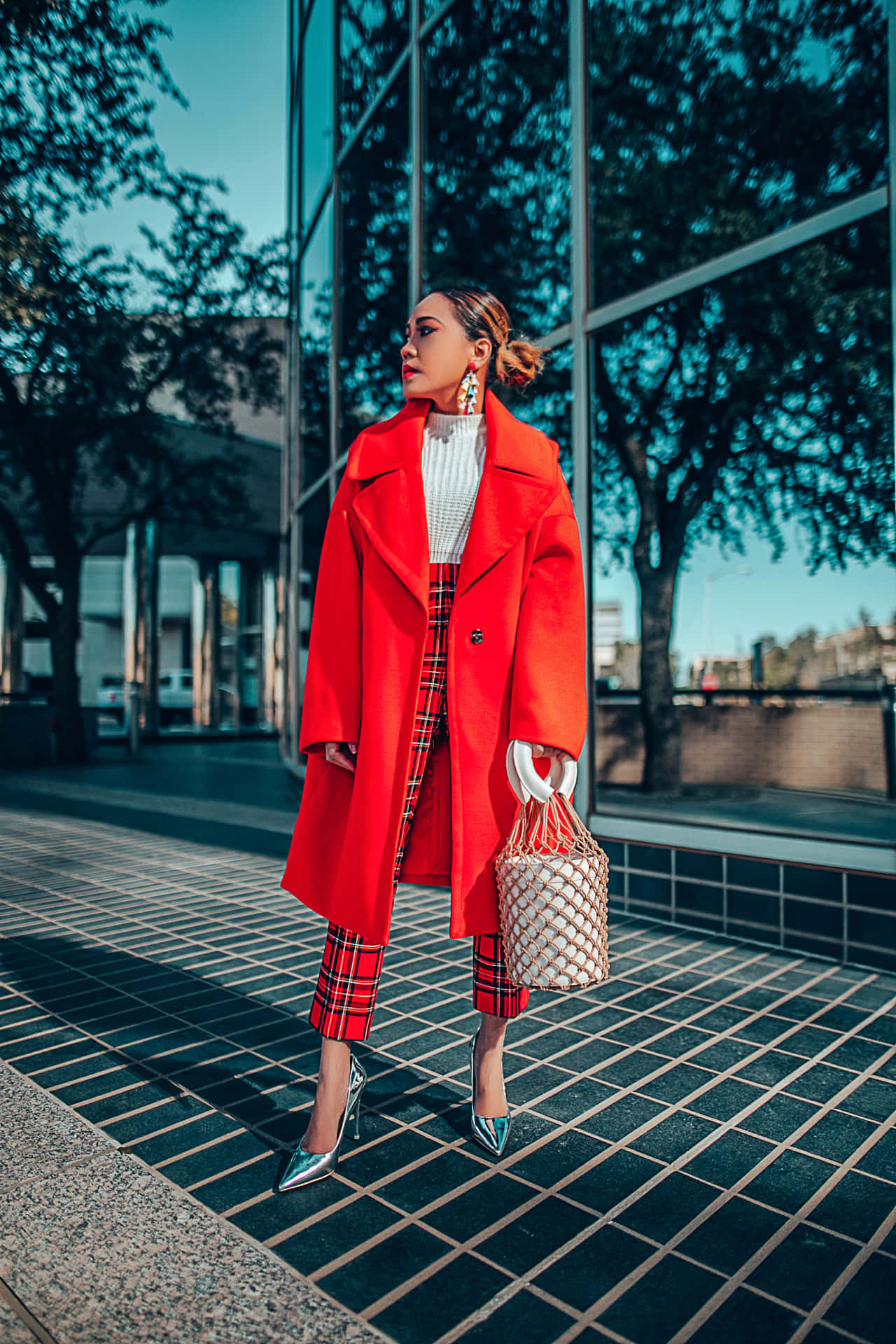 Stylish Woman in Red Coat Posing Outdoors Wallpaper