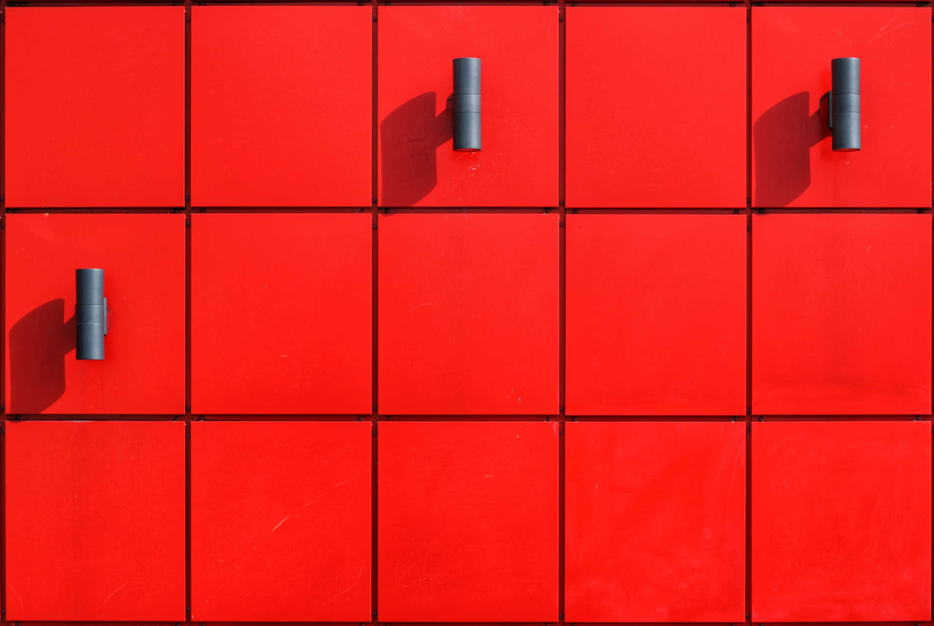 A Red Wall With A Lot Of Squares