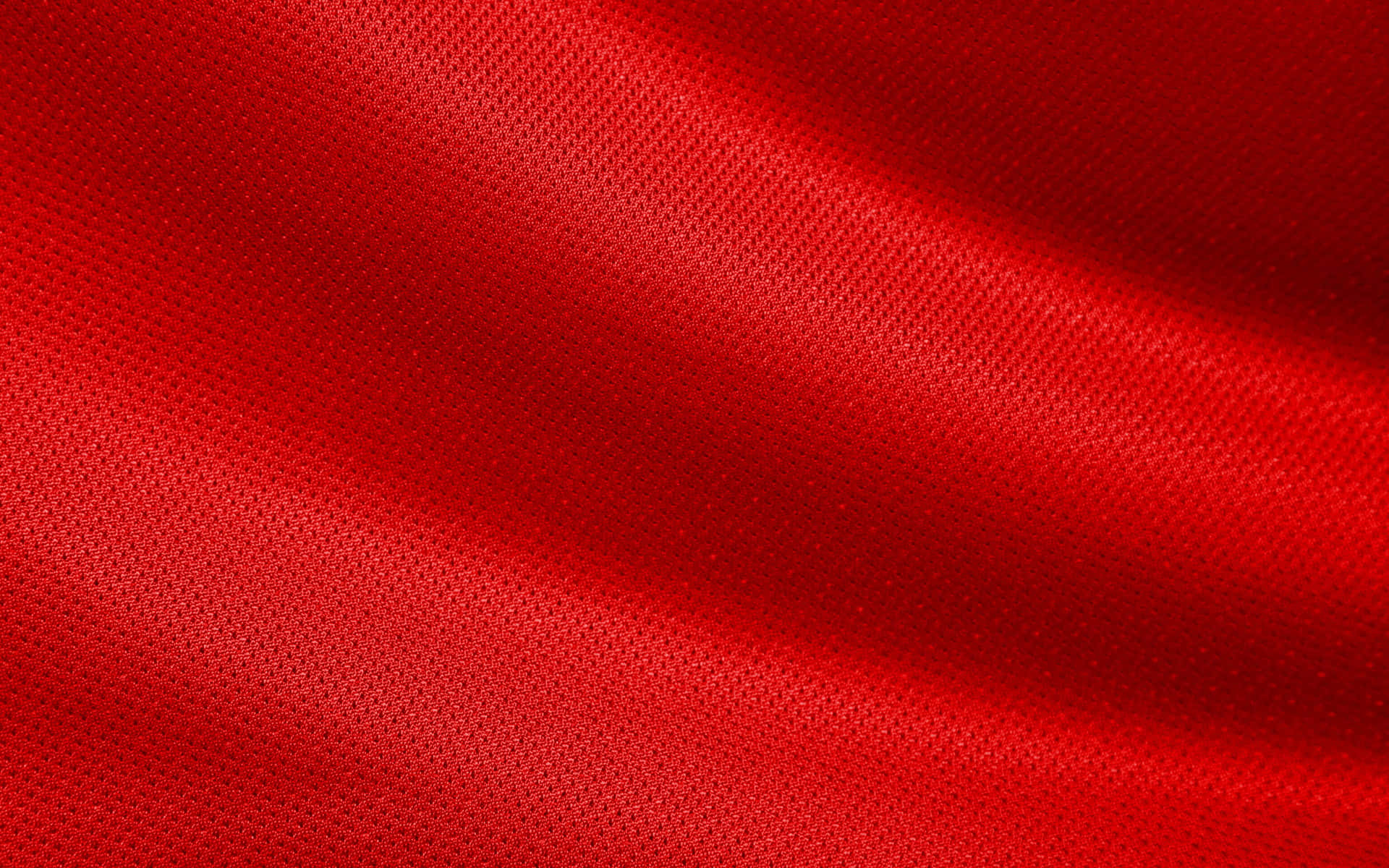 Red Fabric Background With A Smooth Texture