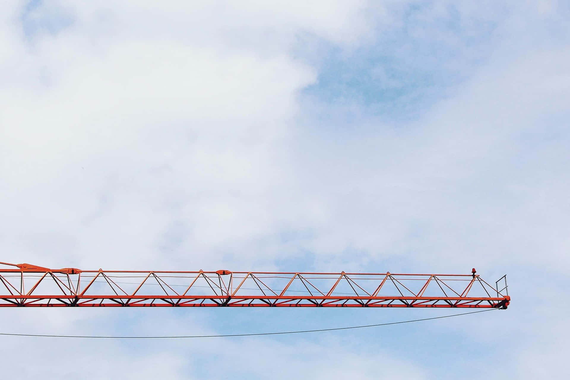 Red Crane Against Blue Sky Wallpaper