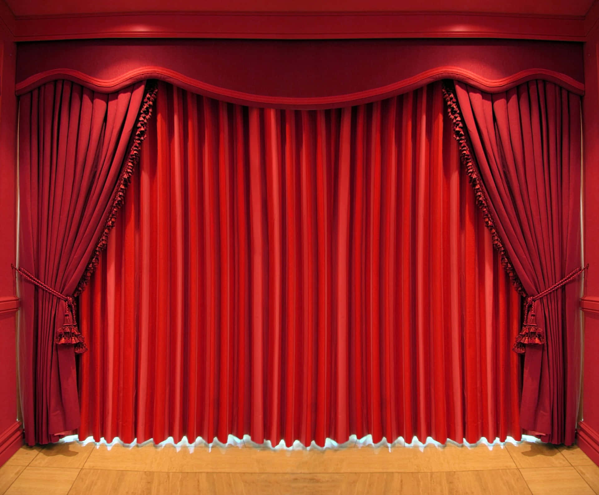 Red curtains open, revealing a scene of awe and wonder