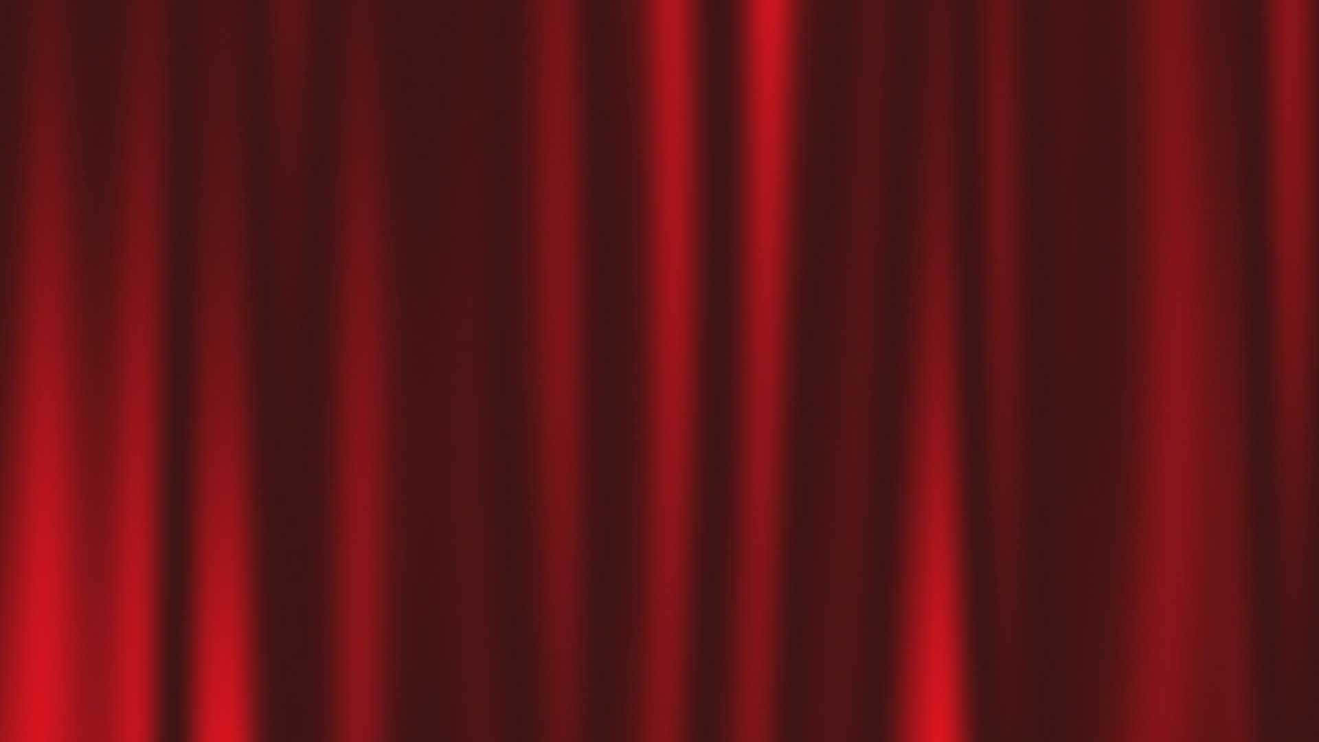 A luxurious red curtain beaming with vibrance