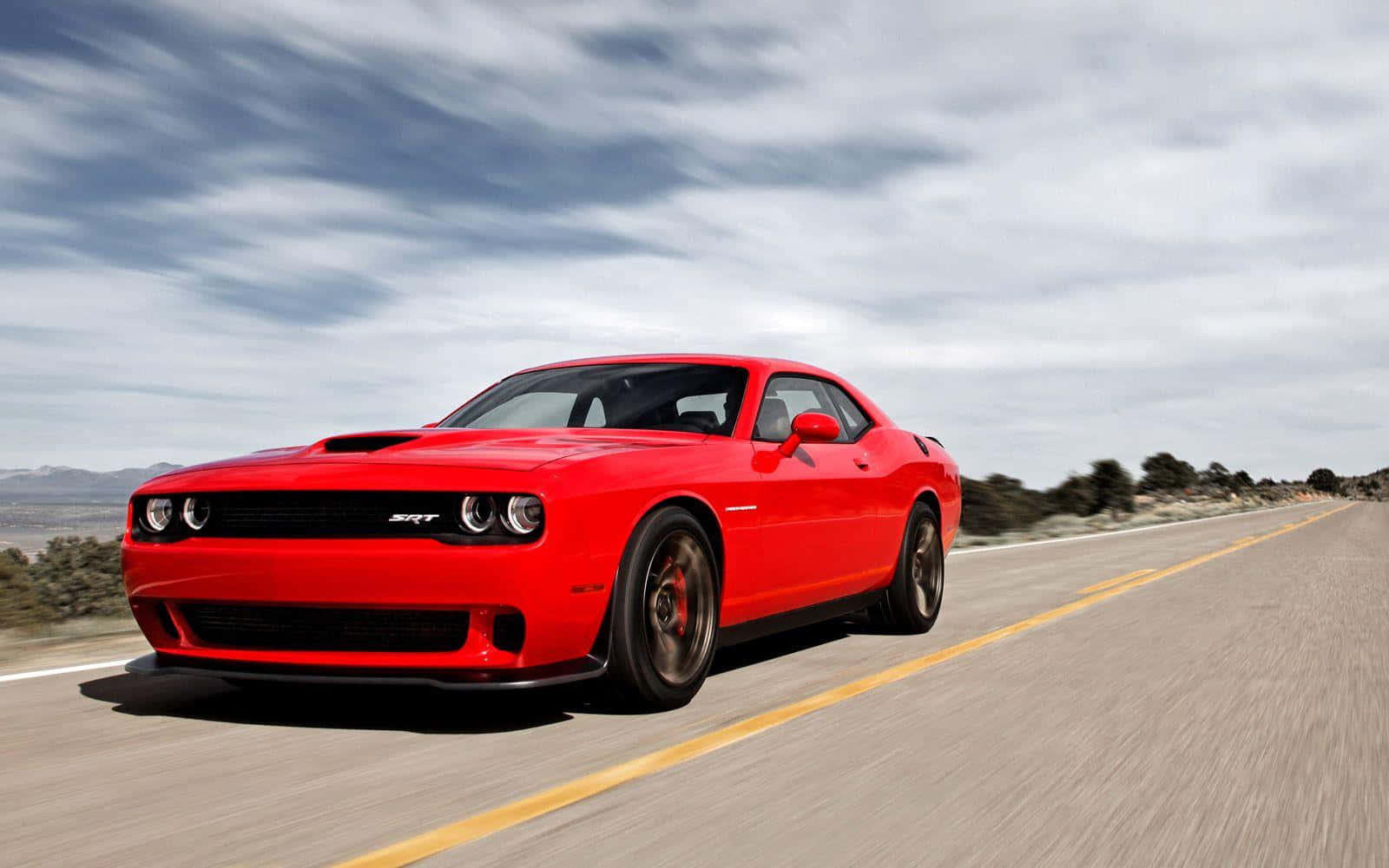 Red Dodge Challenger S R T On The Move Wallpaper