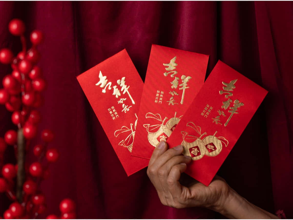 Festive Red Envelopes on a Vibrant Background Wallpaper