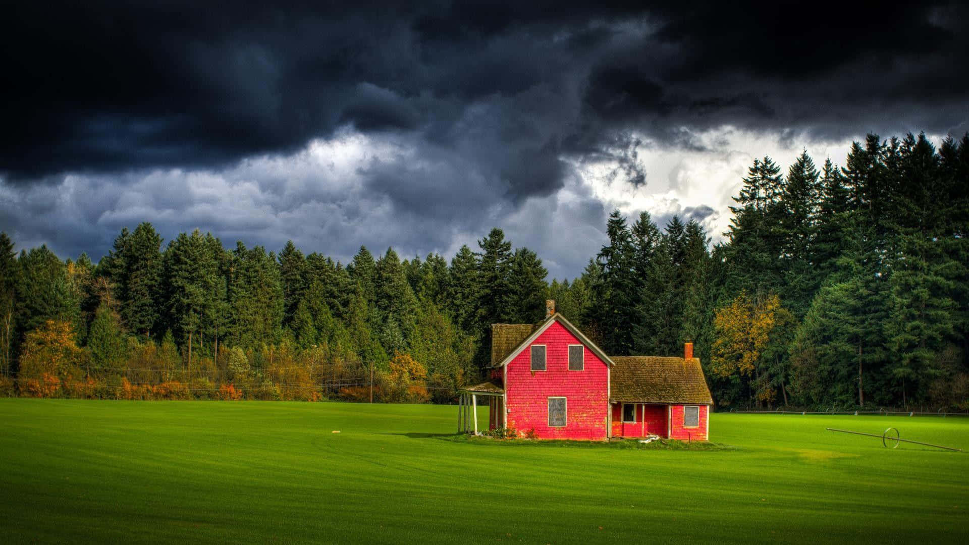 Red Farmhouse Under Stormy Skies Wallpaper
