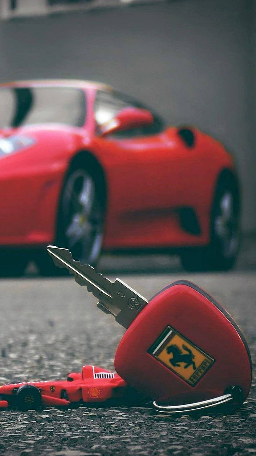 Rød Ferrari Bil og Nøgle På En Lys Grå Baggrund. Wallpaper