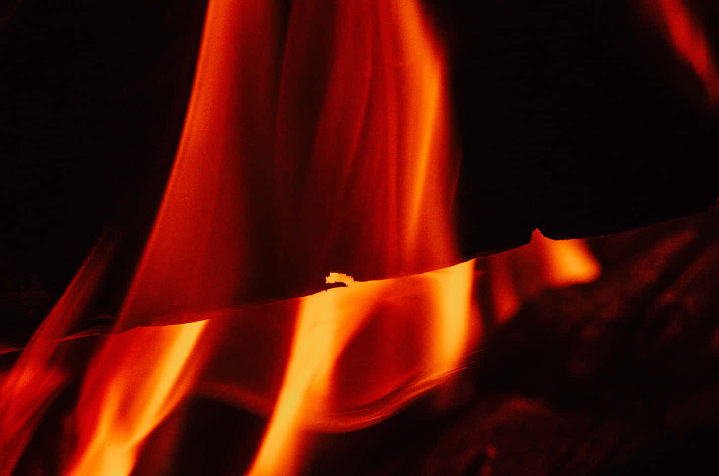 A Fire Burning In A Fireplace