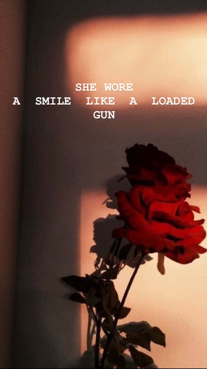 Hun bar et smil som en lastet pistol. Wallpaper