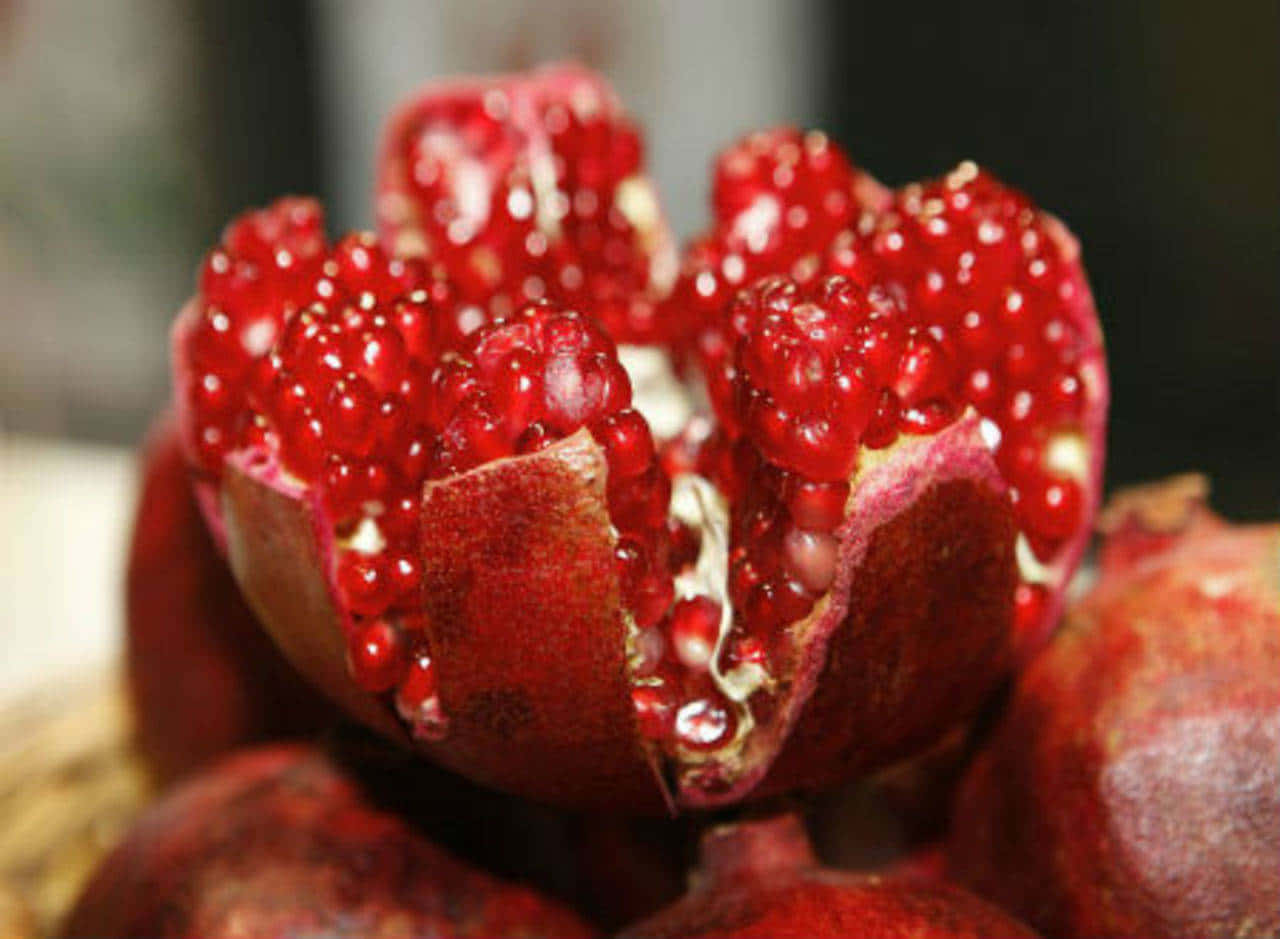Vibrant Red Fruit on Wooden Table Wallpaper