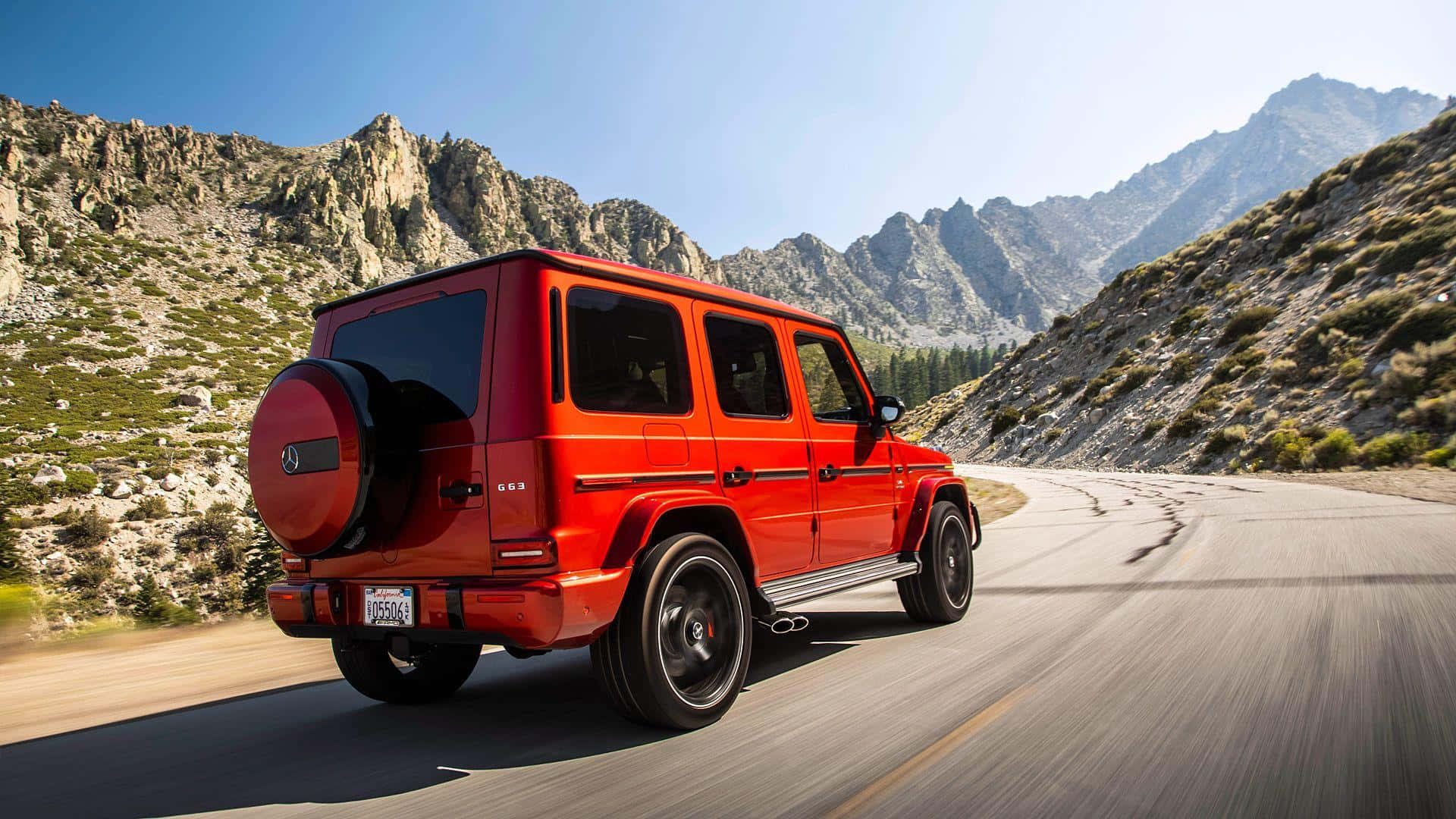 Red G Wagon Mountain Road Wallpaper