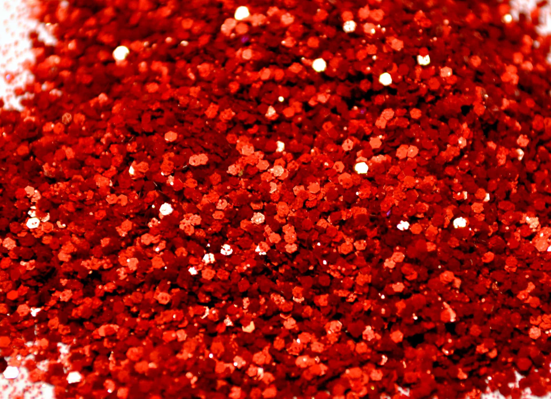 A vibrant, luminous red glitter background perfect for any event.