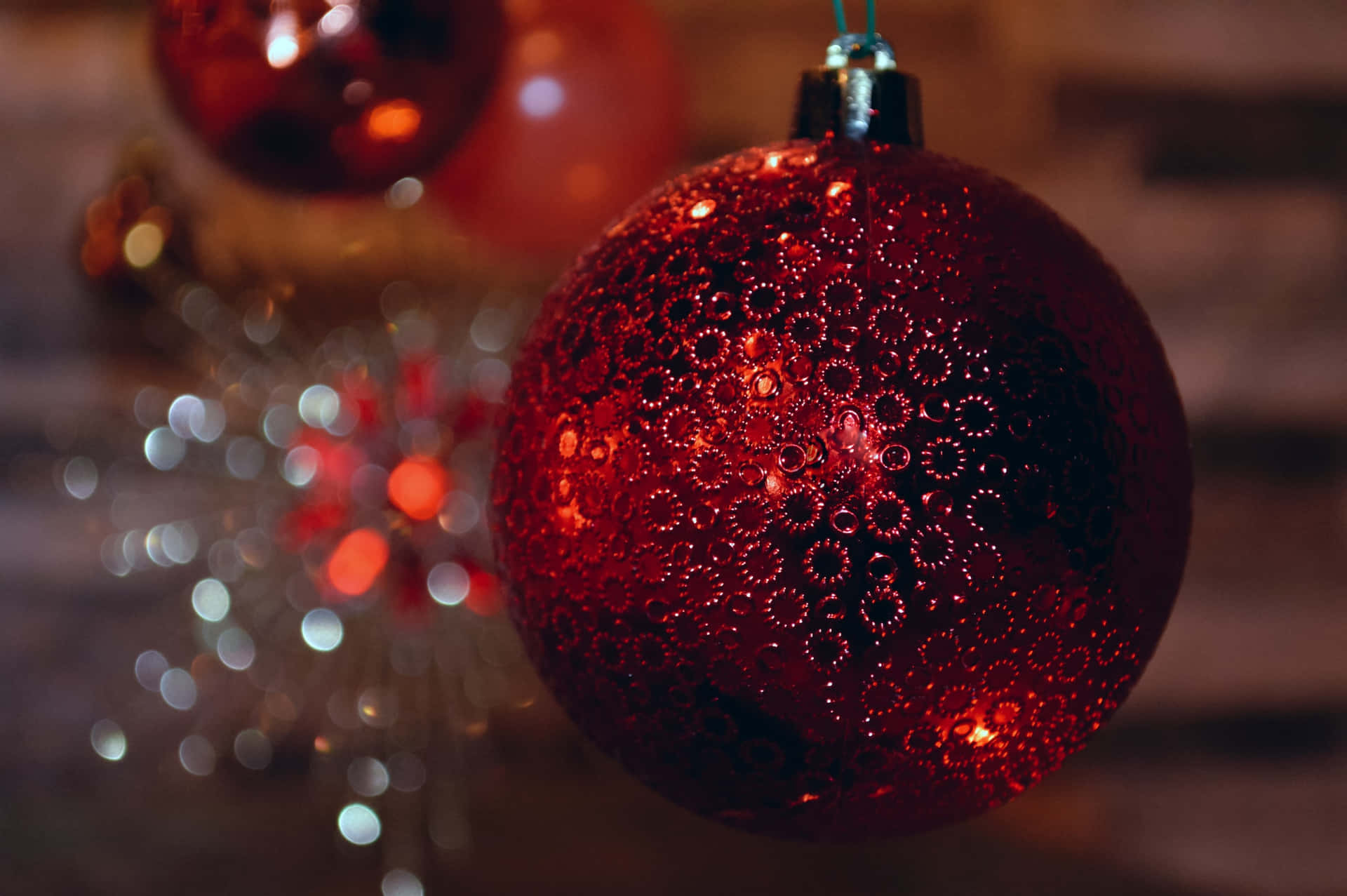Download Christmas Ornaments Hanging From A Tree