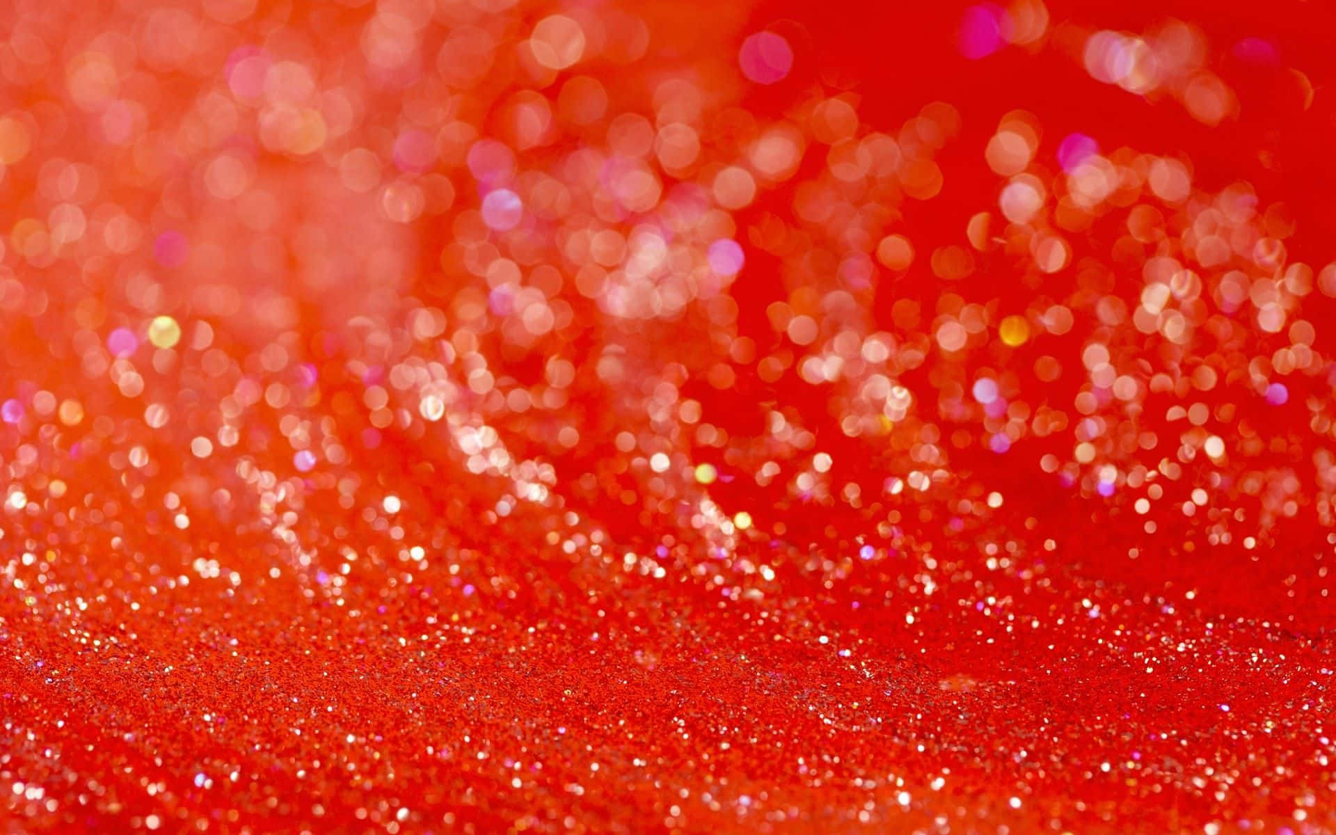 A Red Background With A Lot Of Sparkles Wallpaper