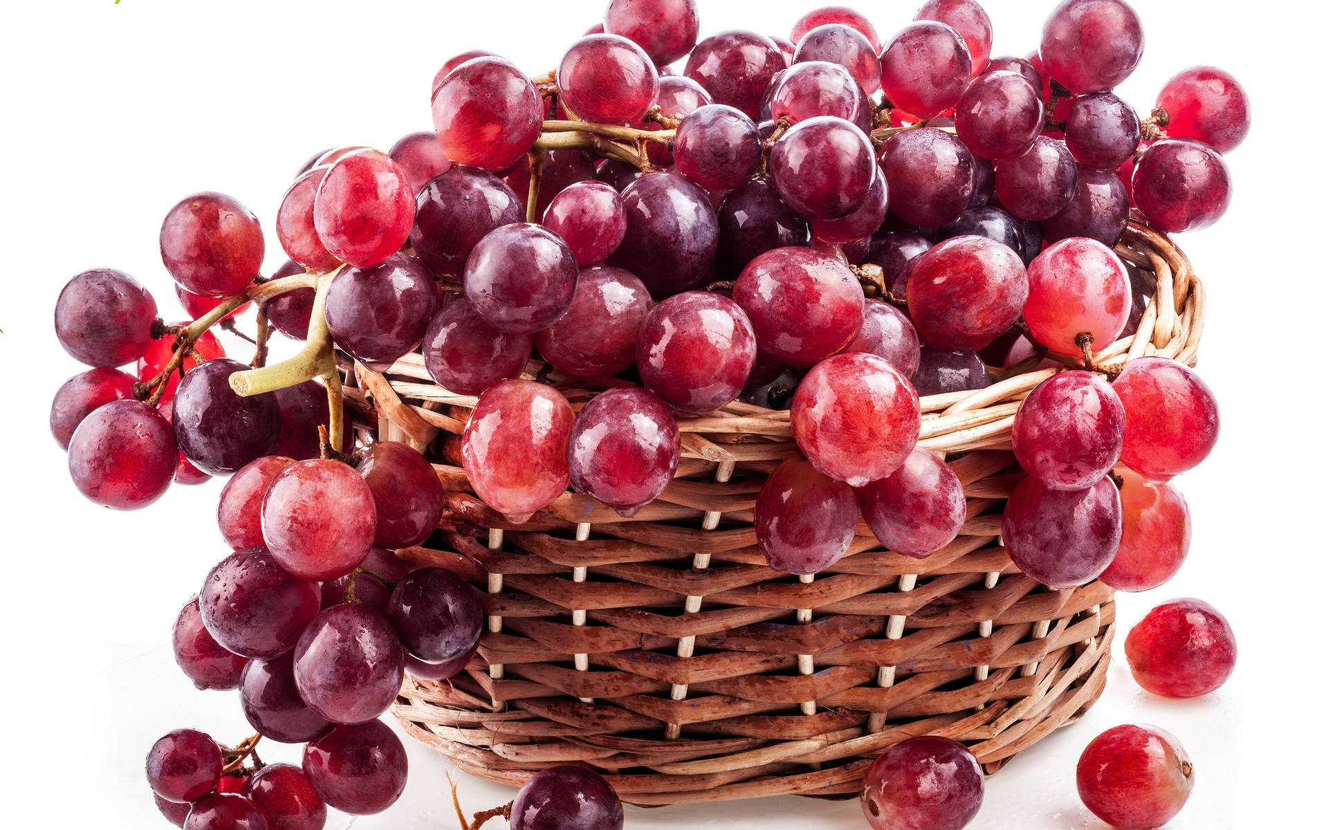 A Basket Full of Luscious Red Grapes. Wallpaper
