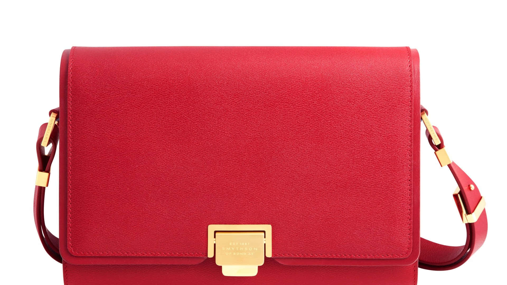 Classy red handbag on a wooden table Wallpaper