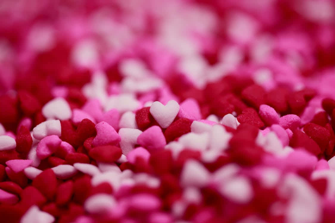 Umclose-up De Corações Rosa E Branco Papel de Parede