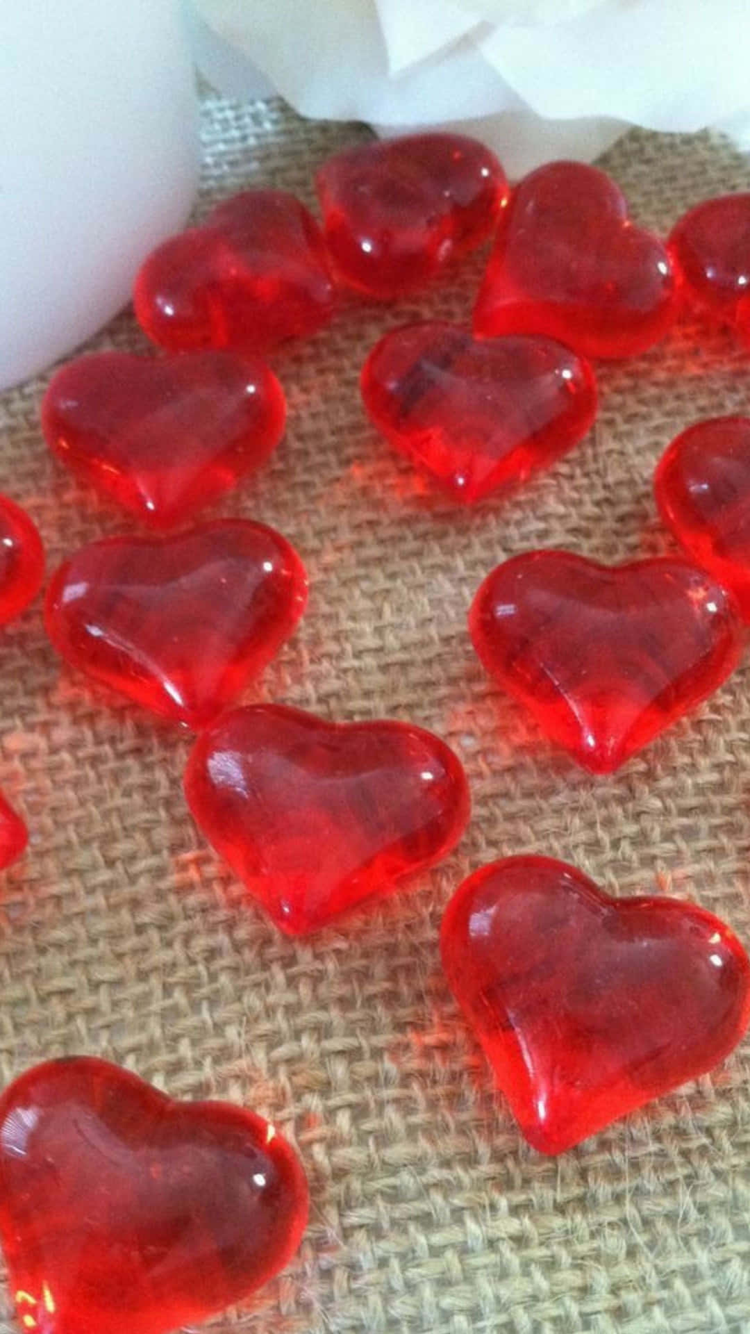 red heart shaped glass beads on a table