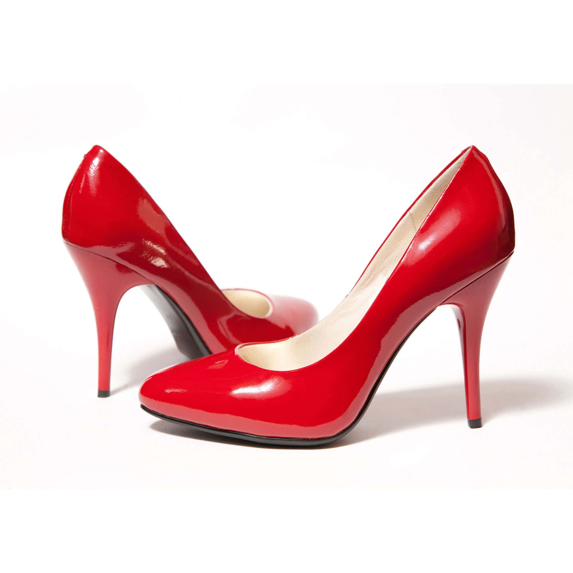 Stylish Red High Heels on a Black Surface Wallpaper