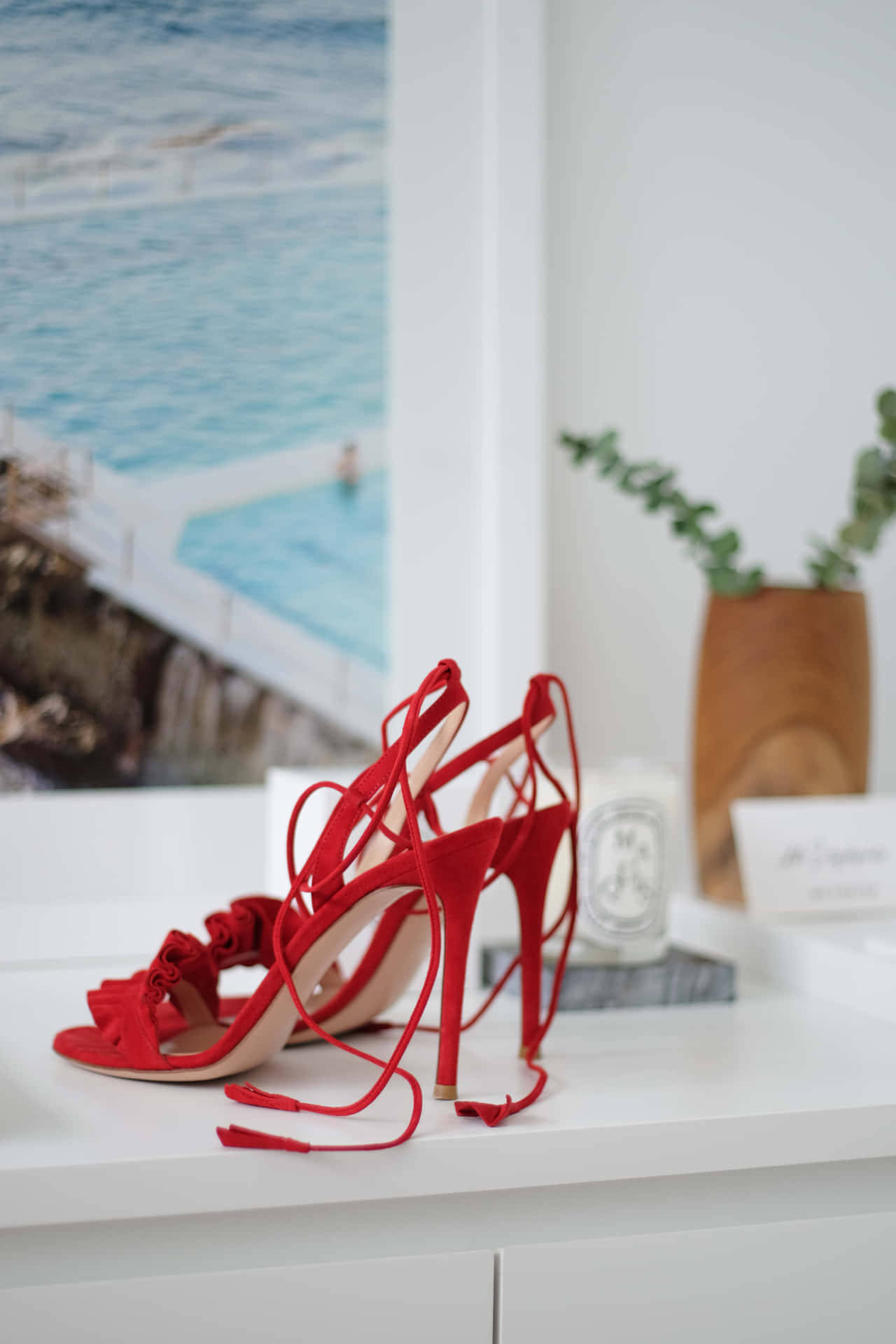 Caption: Elegant Red High Heels on Display Wallpaper