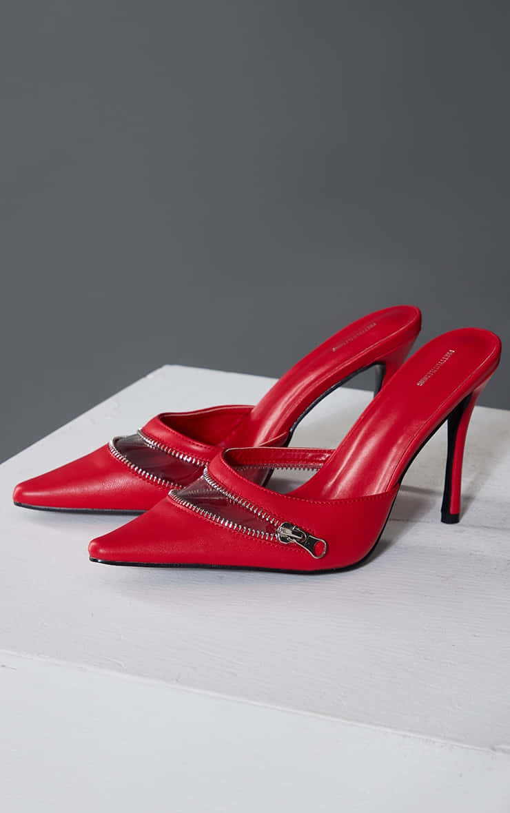 Caption: Elegant Red High Heels Wallpaper