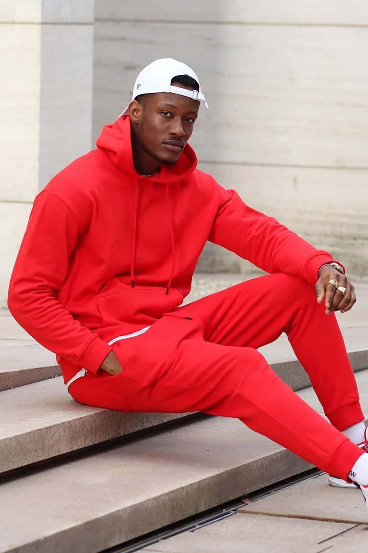 Stylish man in bold red hoodie Wallpaper