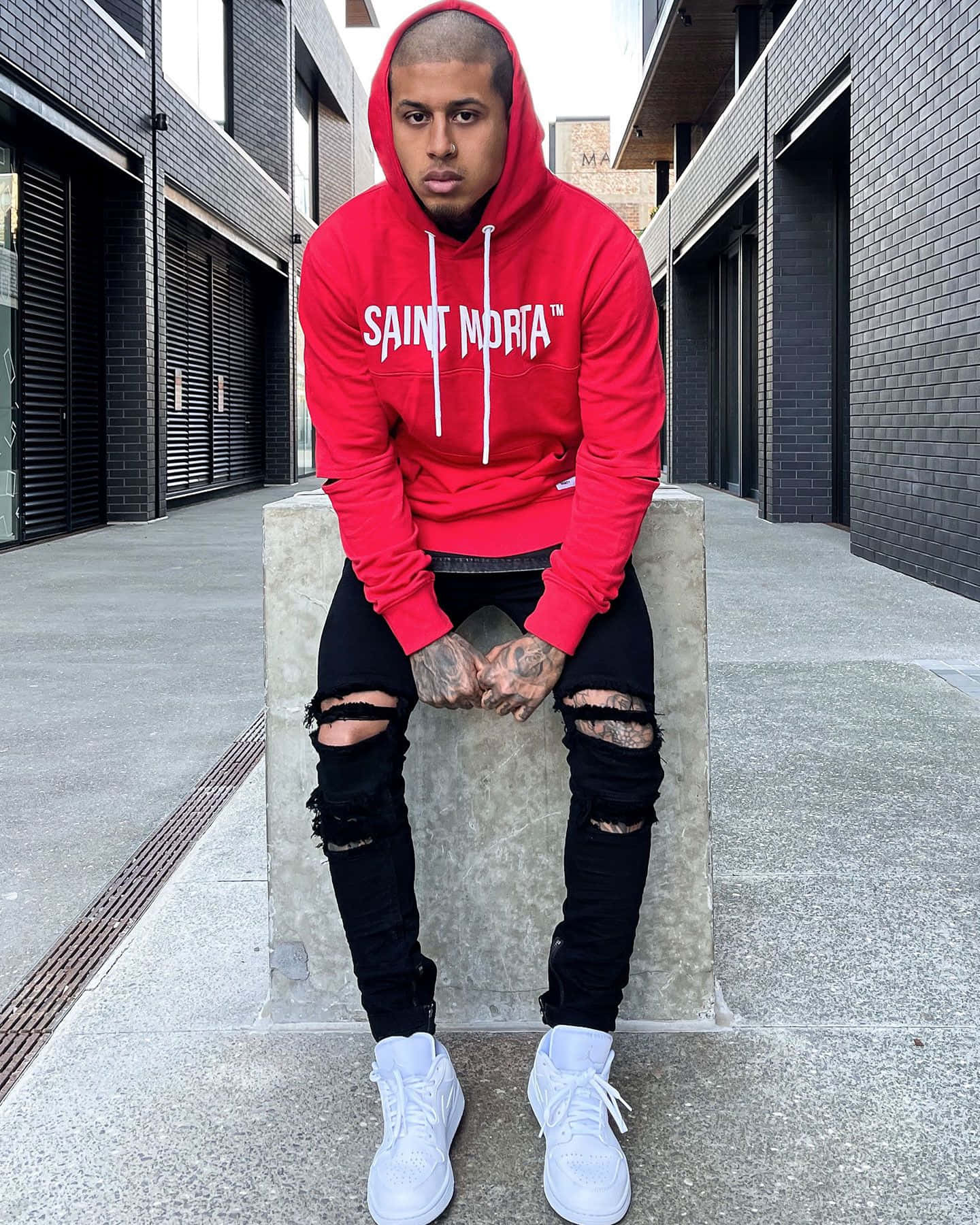 Trendy Red Hoodie on a Minimalist Gray Background Wallpaper